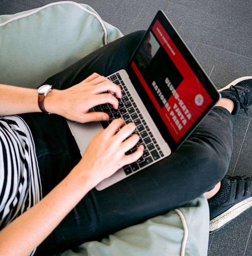 man creating a presentation on laptop