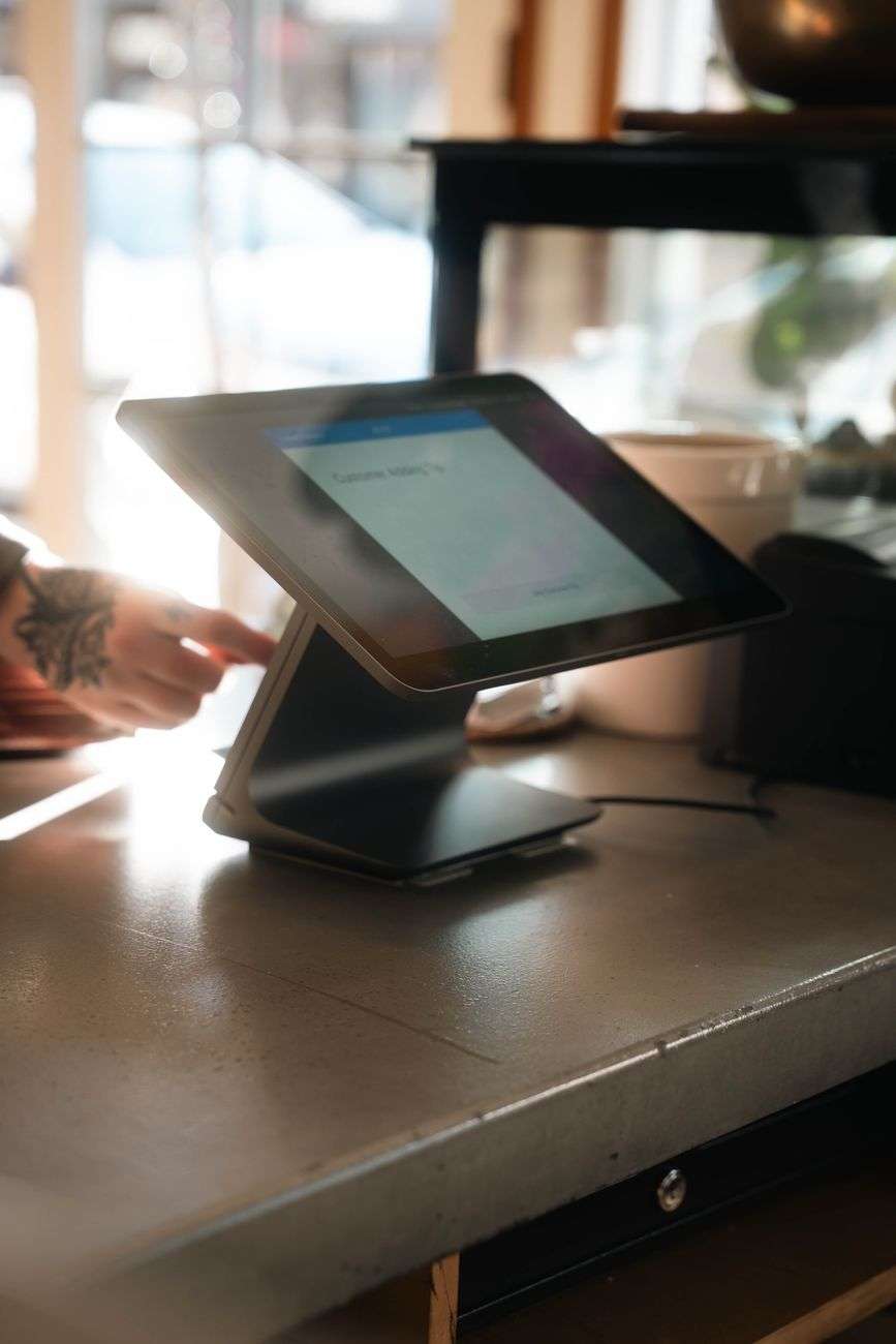 modern pos system in coffee shop setting